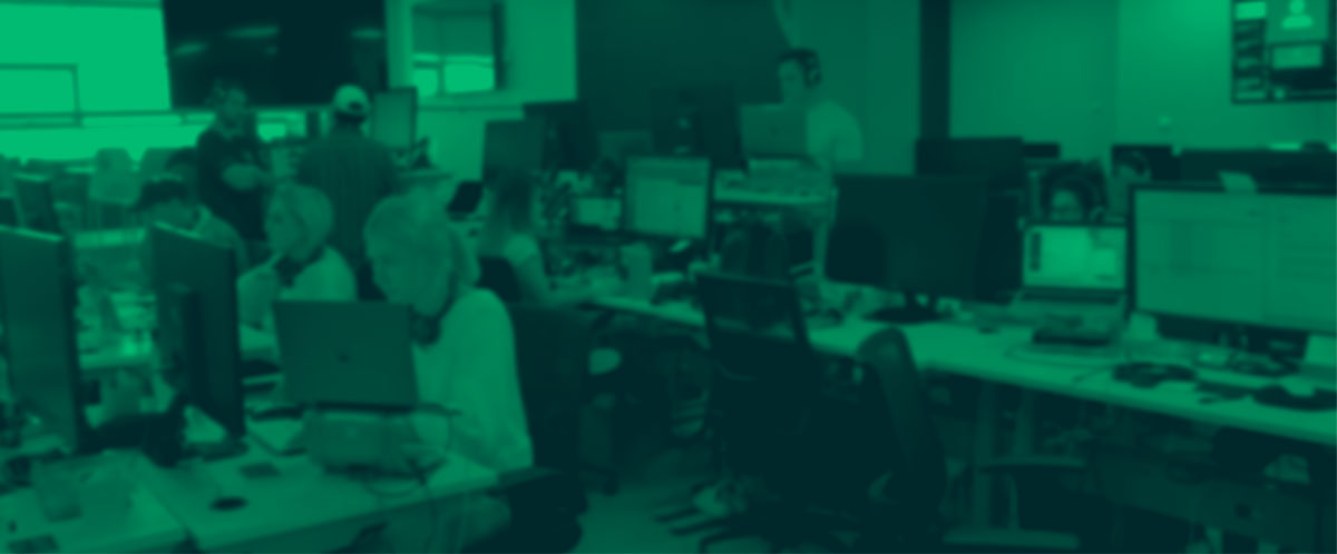 People at computers, green tint